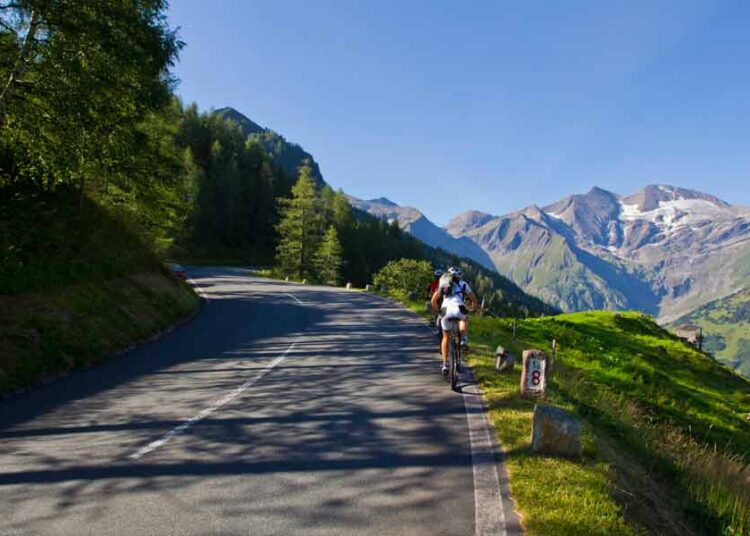 Grossglockner biker on the way to the top, alpine pass for cyclists